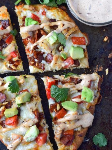 chicken club flatbread cut into slices with a side of chipotle ranch
