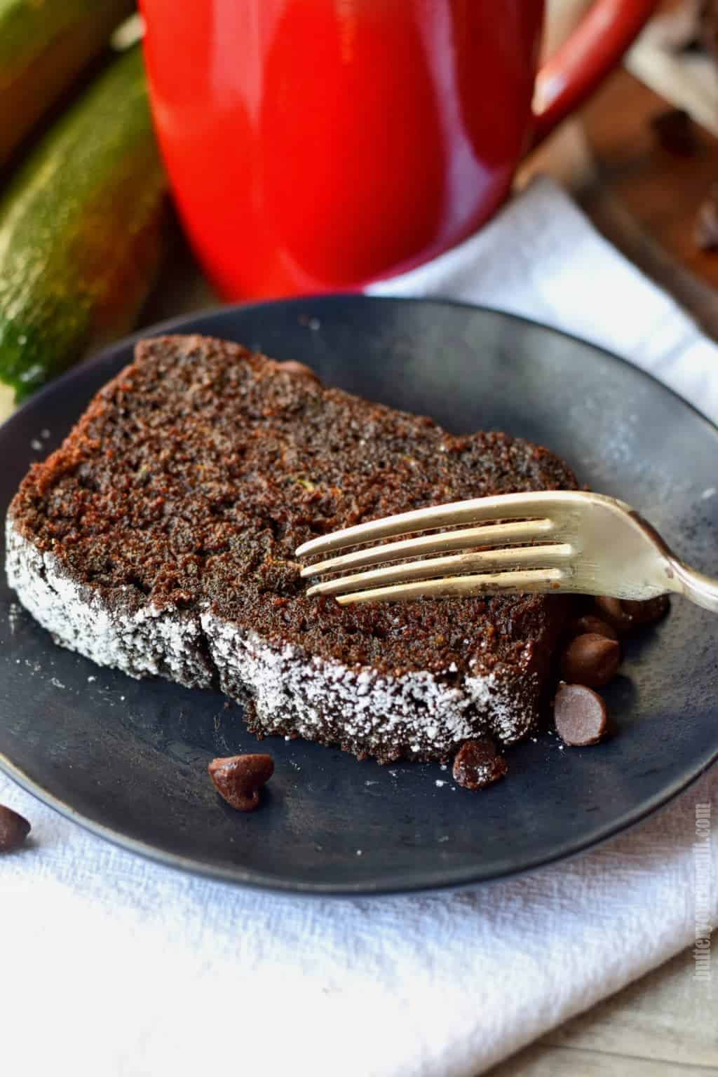 chocolate zucchini bread on a black plate