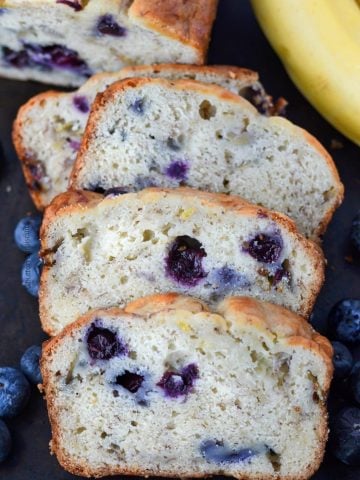 Banana Blueberry bread on a cutting board scliced