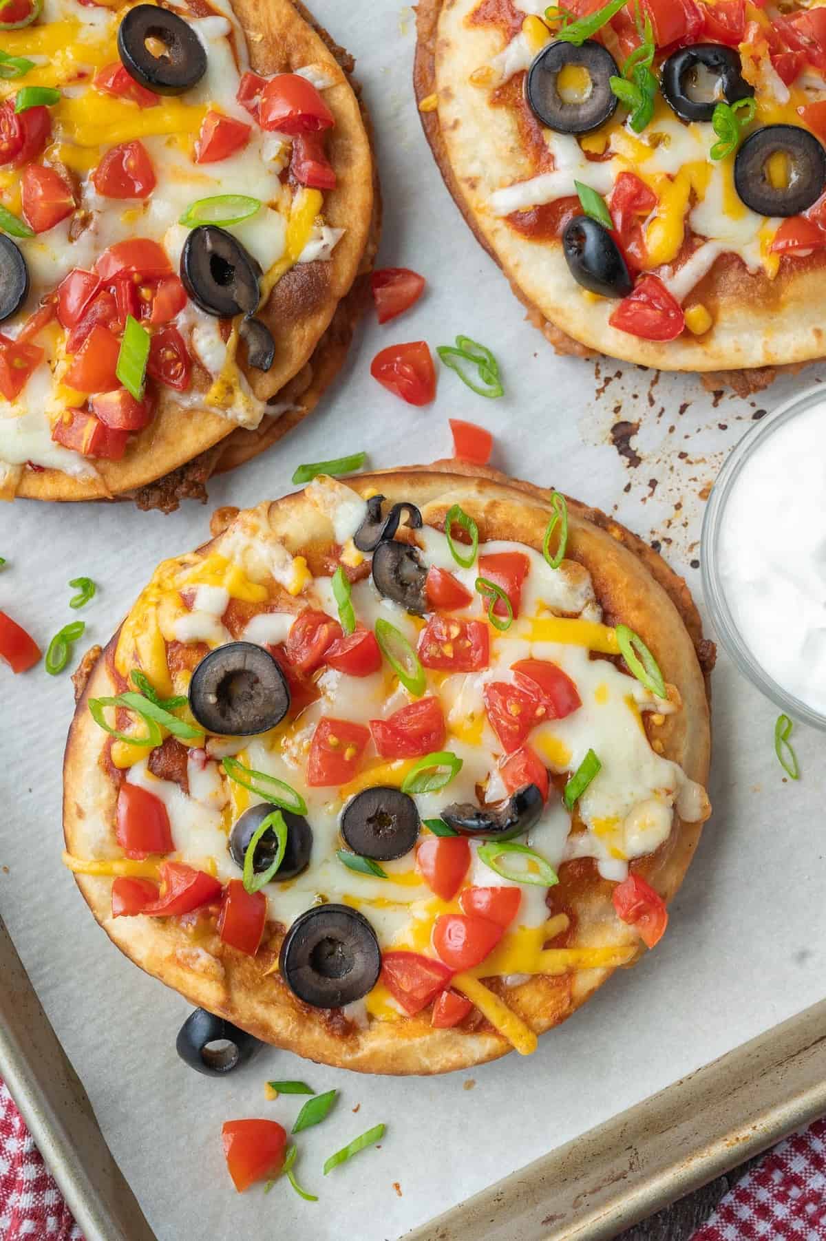 Mexican pizza on a baking sheet.