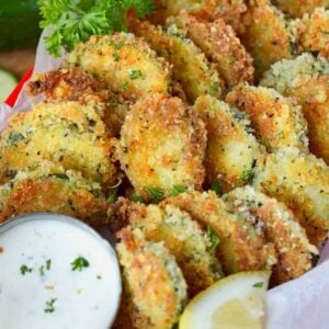 A close up of food, with Zucchini Parmesan crisps.