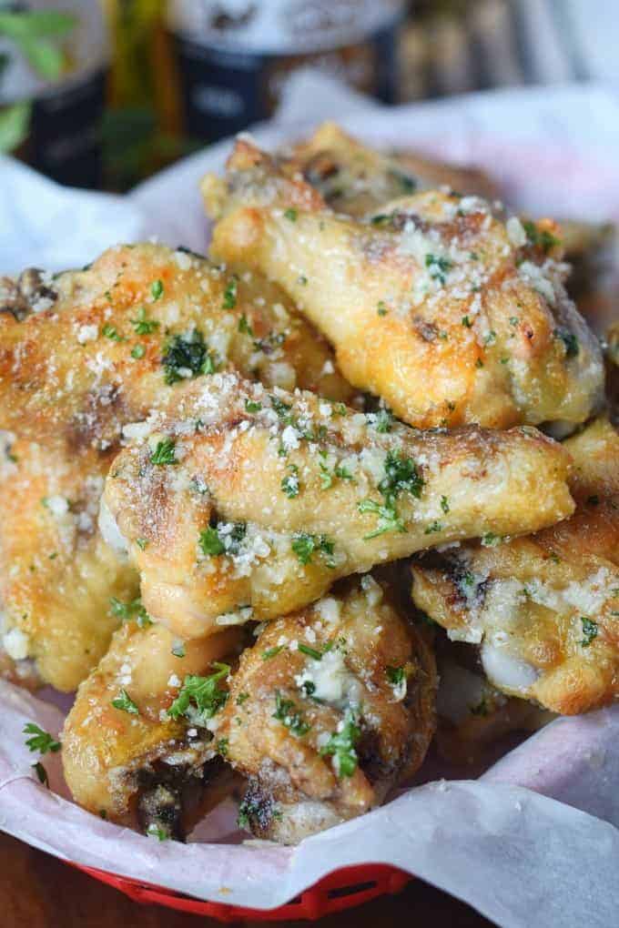 A close up of food, with Chicken wings and Garlic