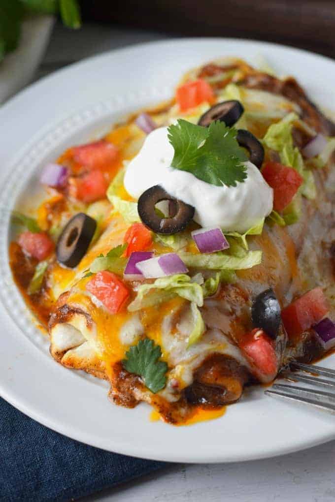 A close-up of a smothered chicken burrito.