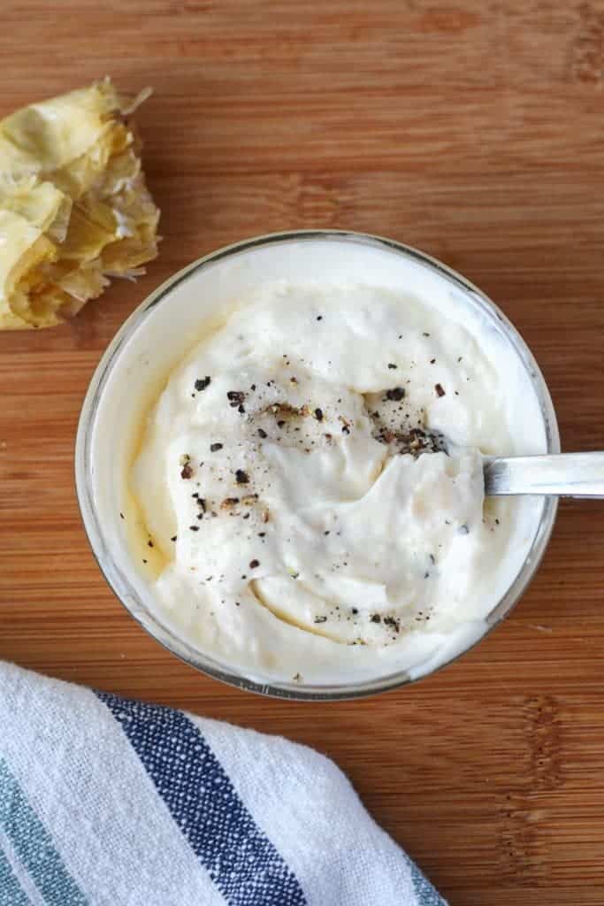 Garlic mayonnaise mixed together in a small bowl.