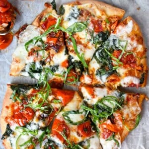 A pizza sitting on top of a table