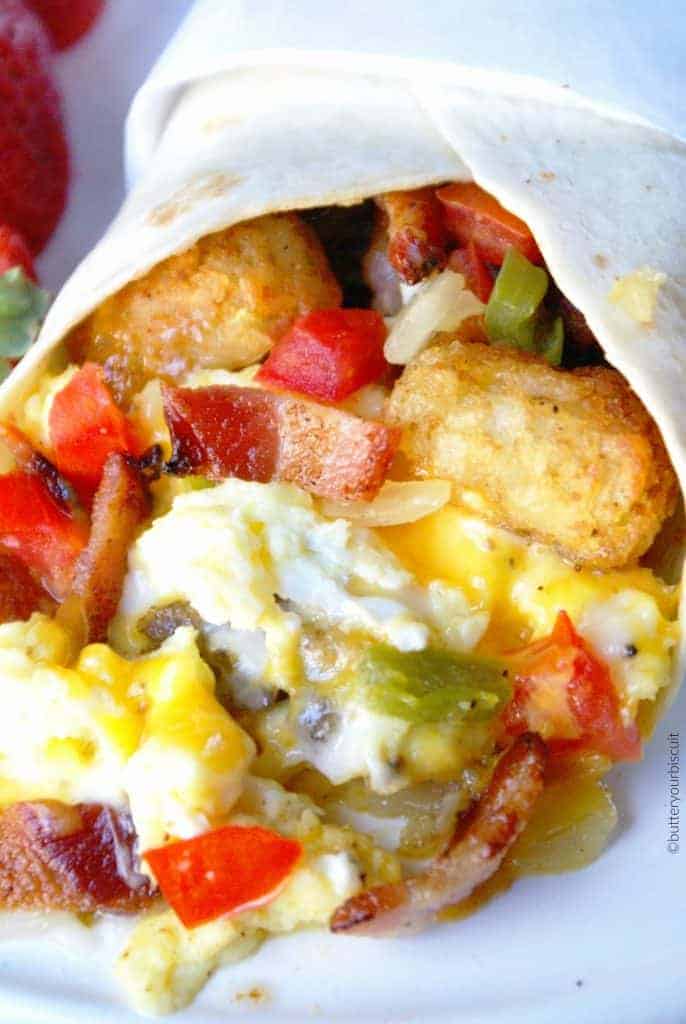 A close up of a plate of food with Breakfast burrito