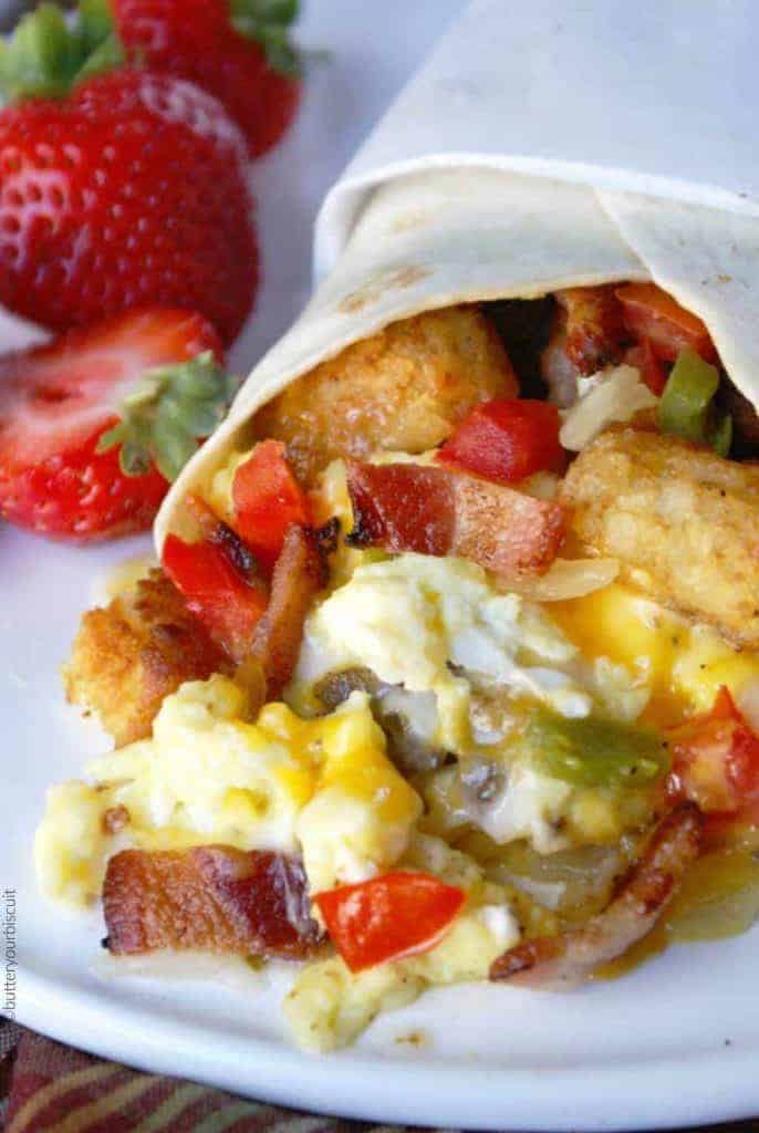 A close up of food on a plate, with Breakfast burrito