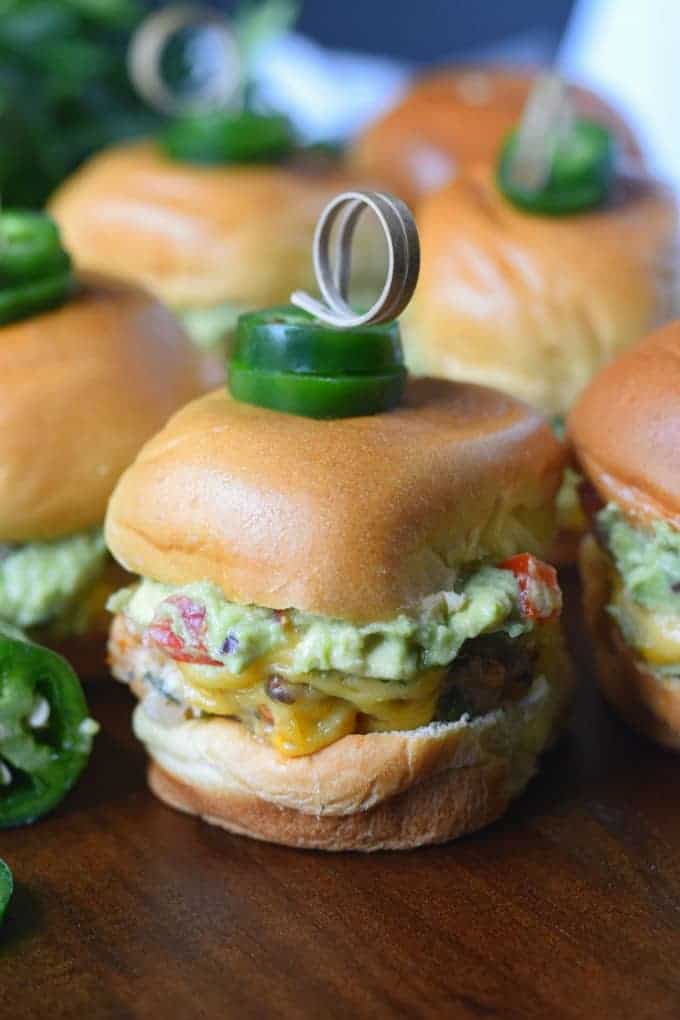 A close-up of food on a table, a chicken slider.