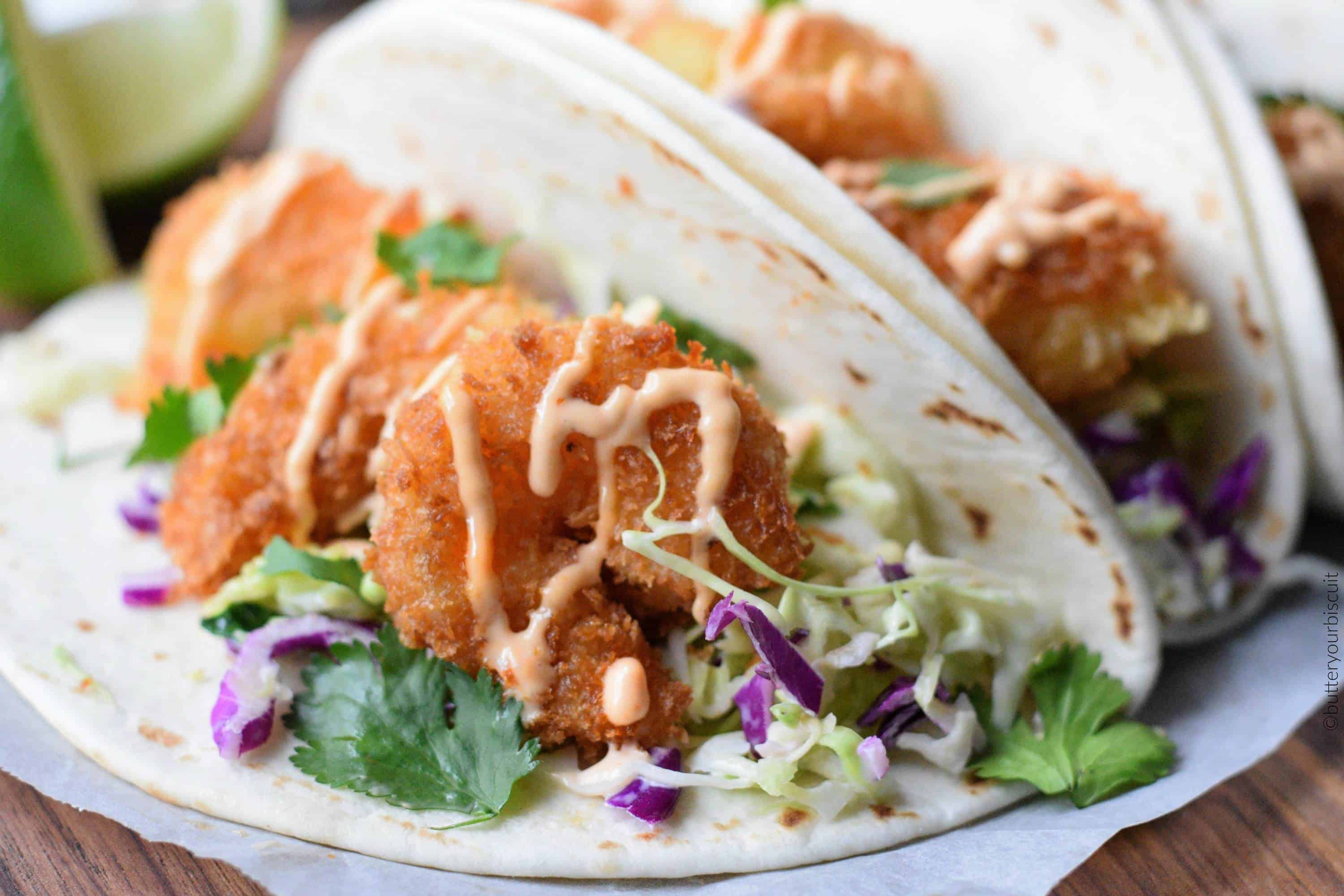 crispy shrimp tacos on a cutting board