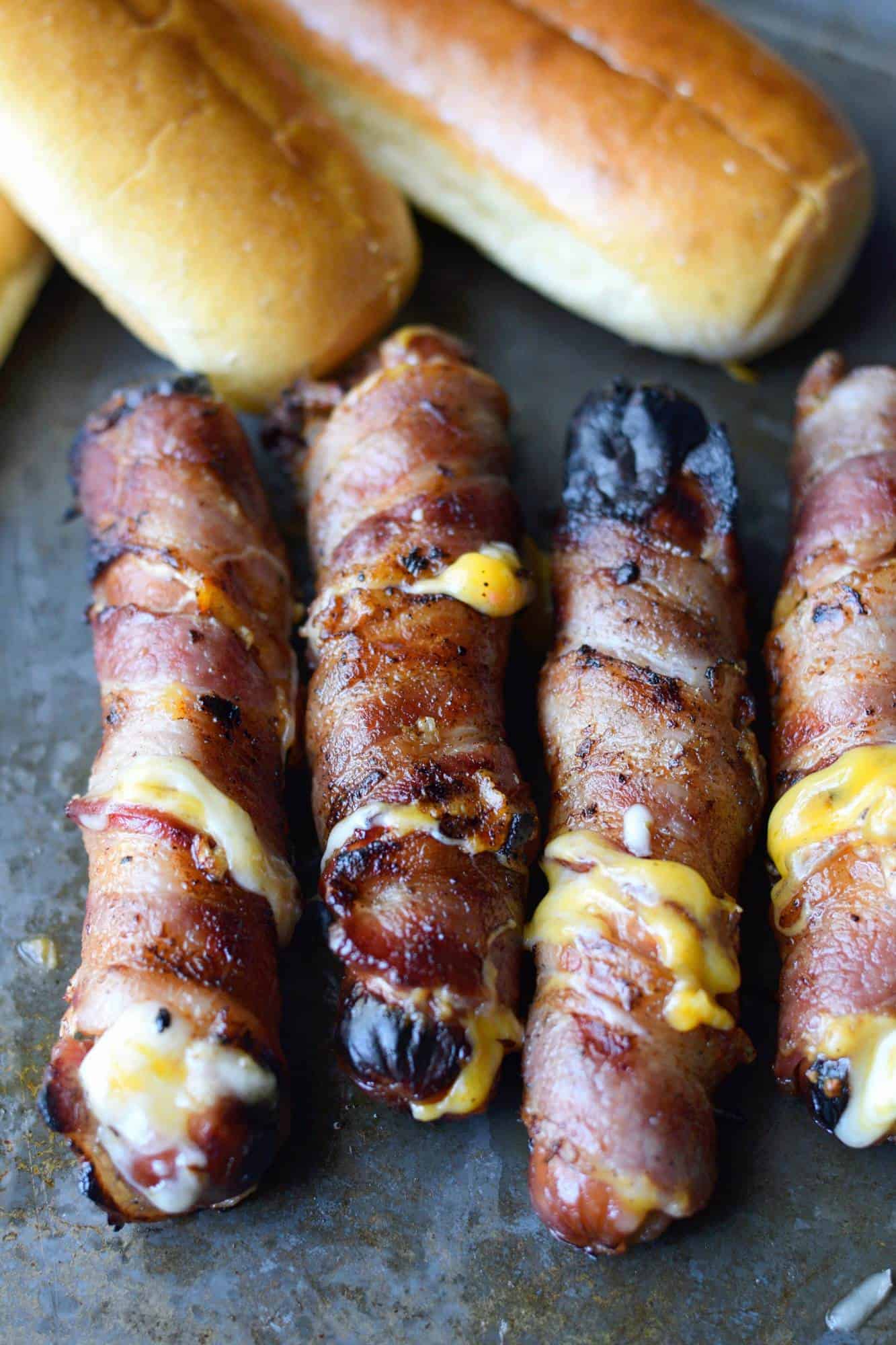 Bacon wrapped cheese stuffed hot dogs