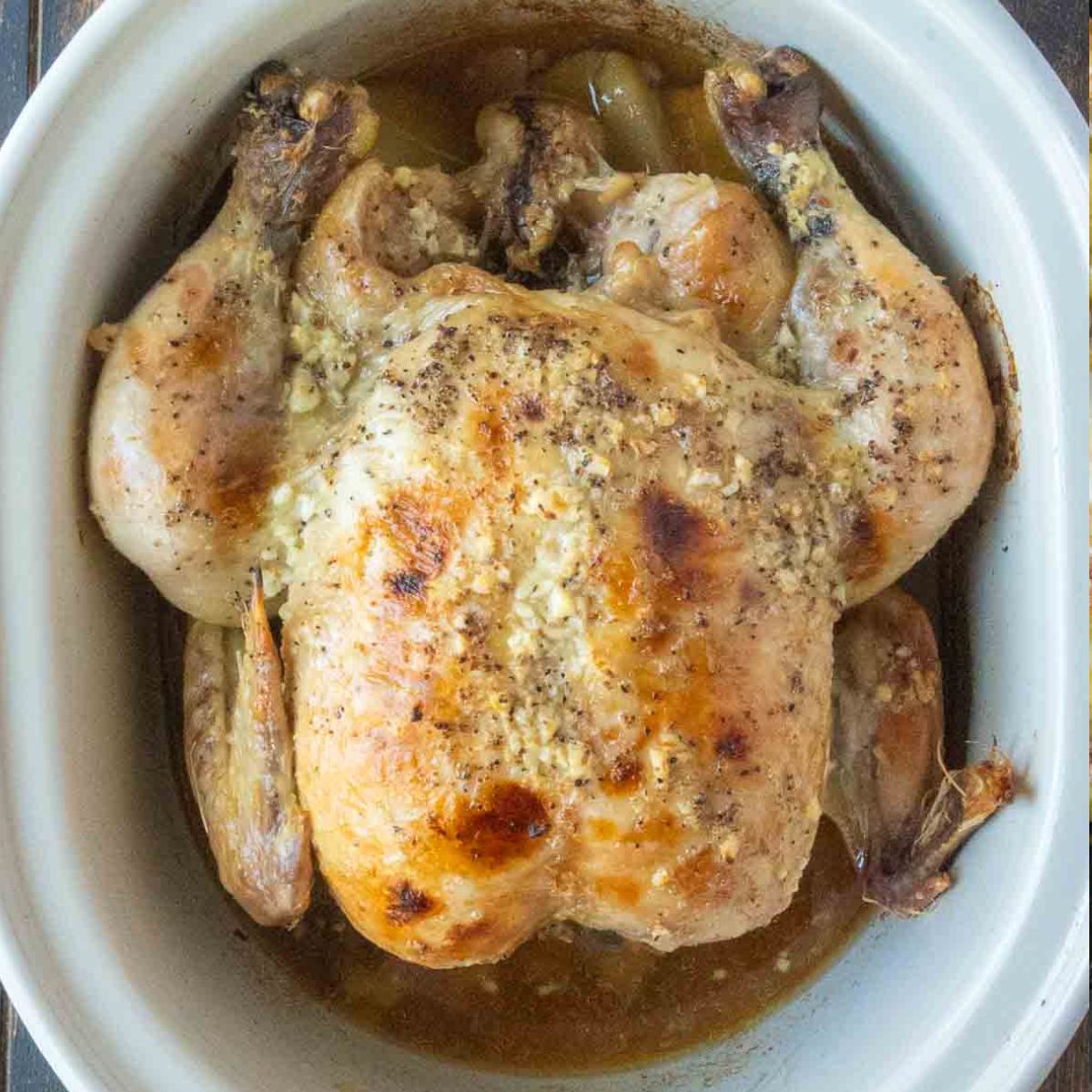 A whole chicken cooked in a slow cooker.
