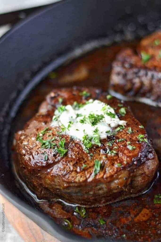 Filet Mignon with Garlic herb butter in a cast iron skillet.