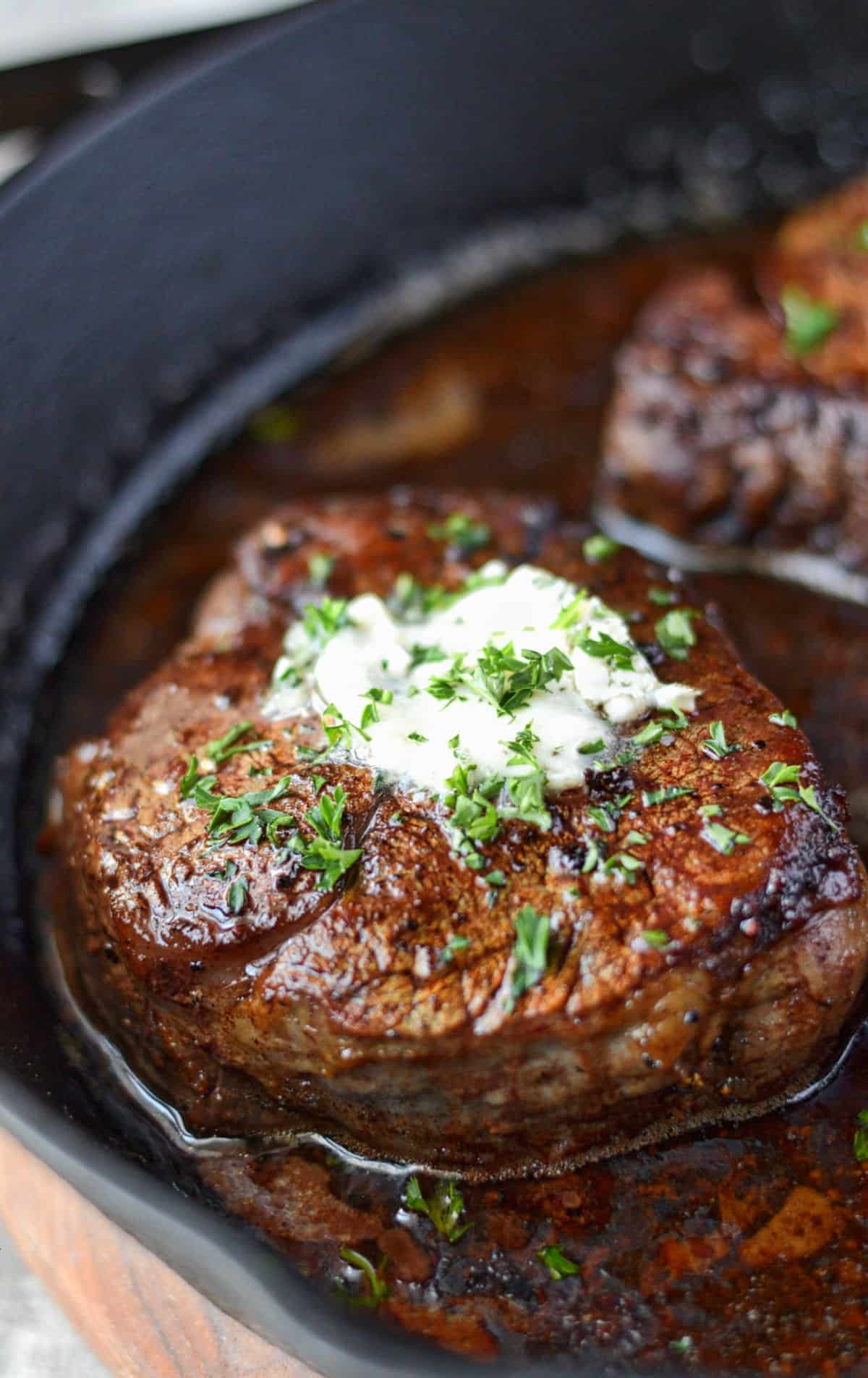 Filet mignon in a cast iron skillet.