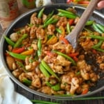 Sweet and spicy chicken stir fry in a skillet.