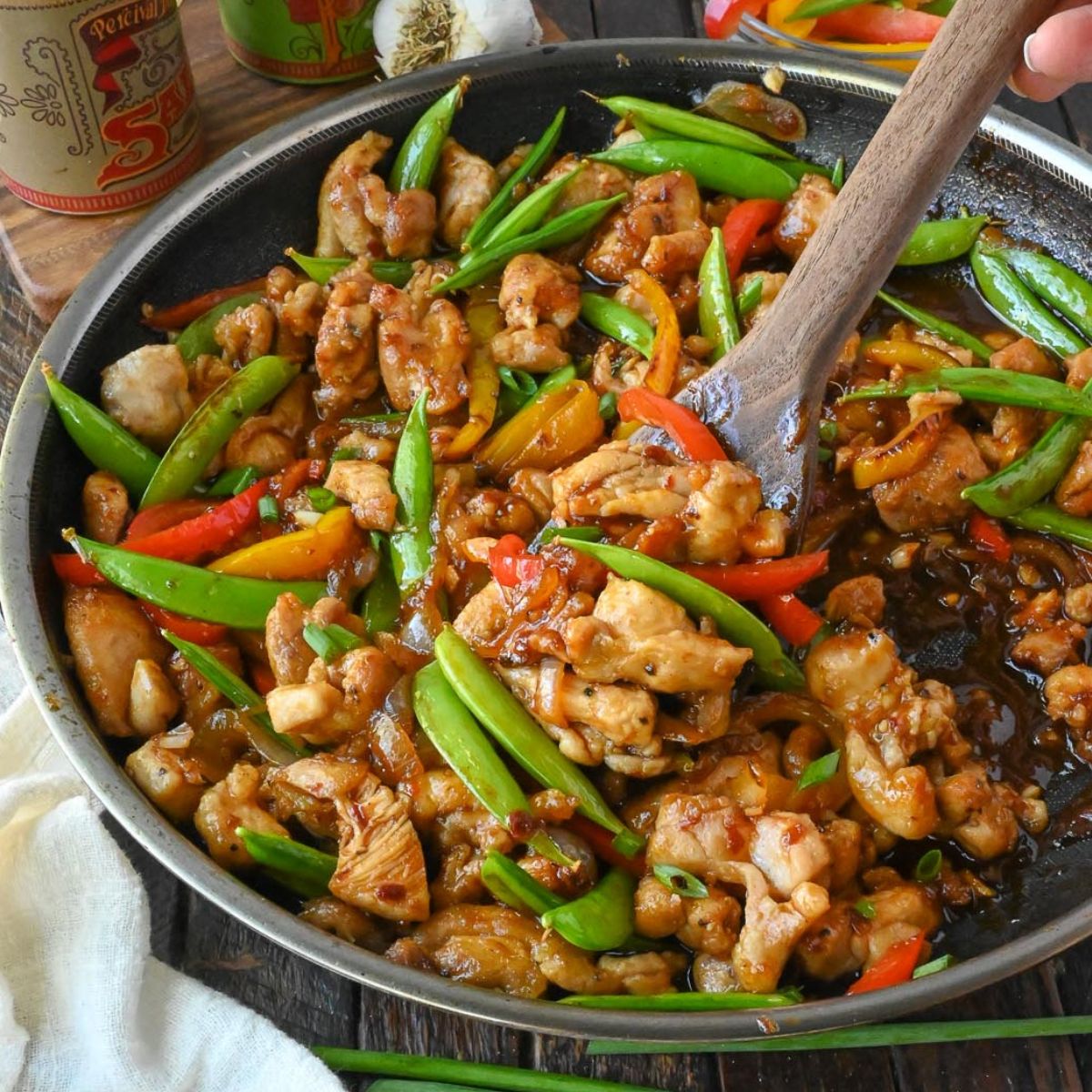 Sweet and spicy chicken stir fry in a skillet.