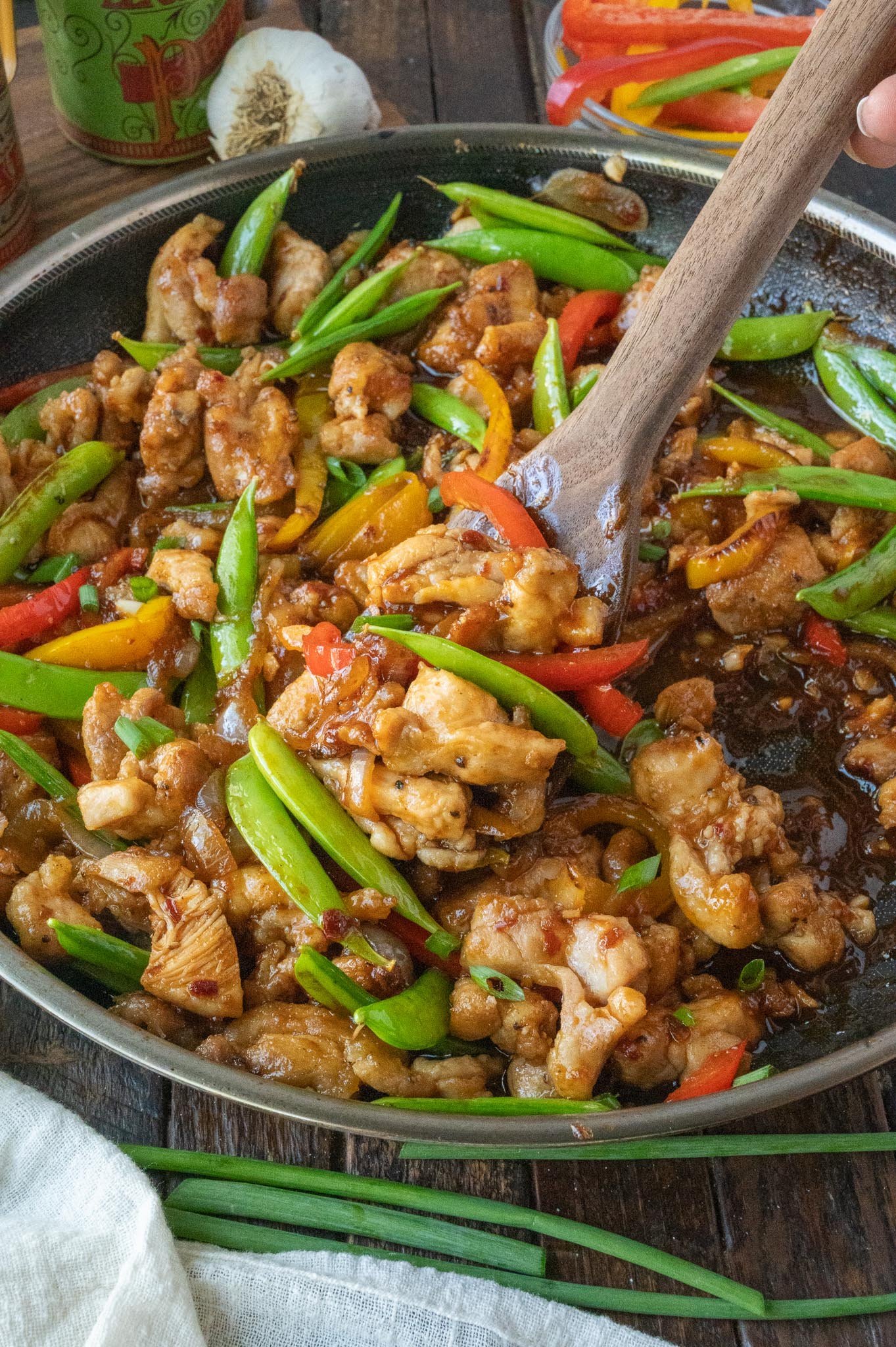 Sweet and spicy chicken stir fry in a skillet.