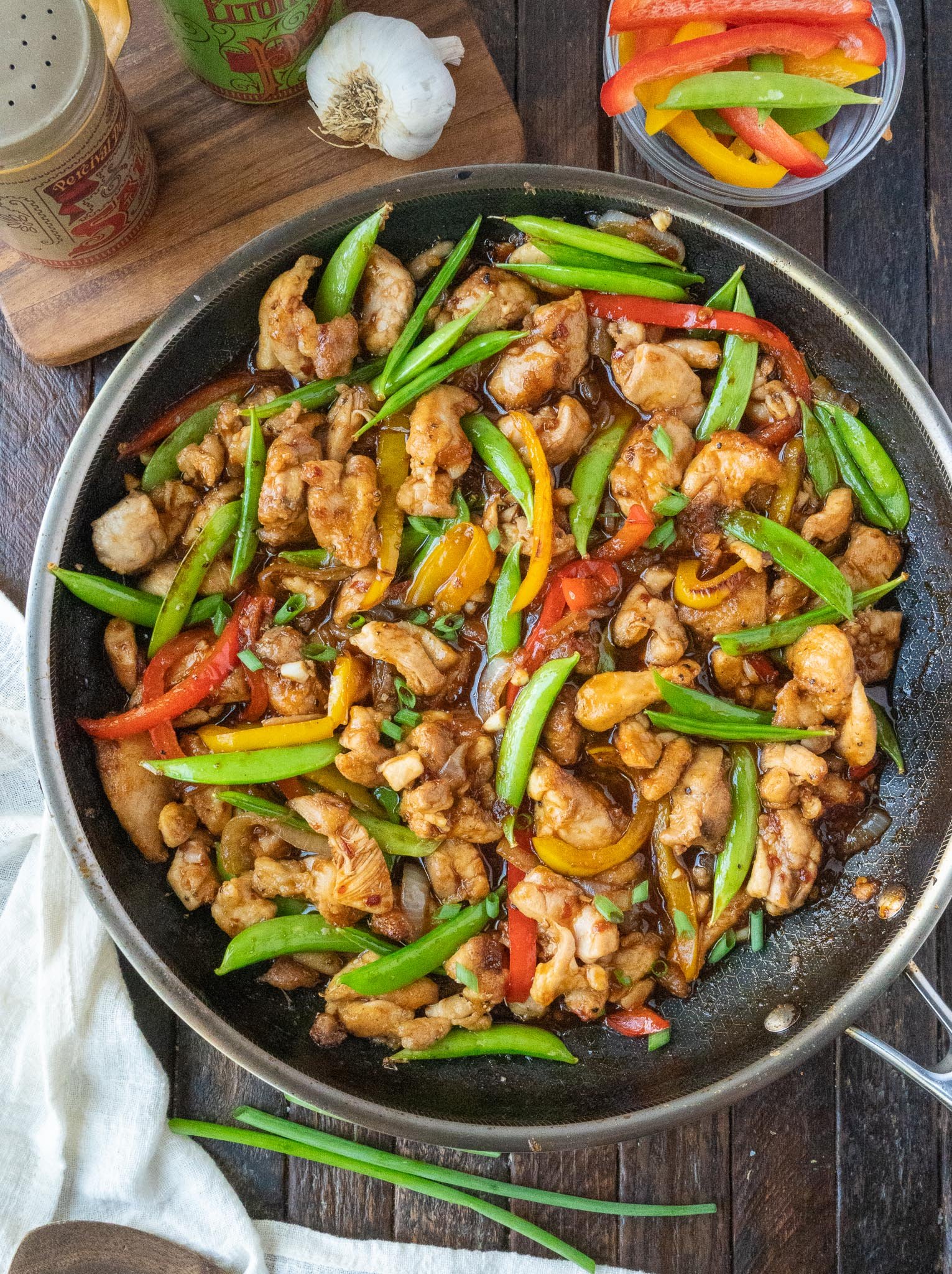 Chicken stir fry in a skillet.