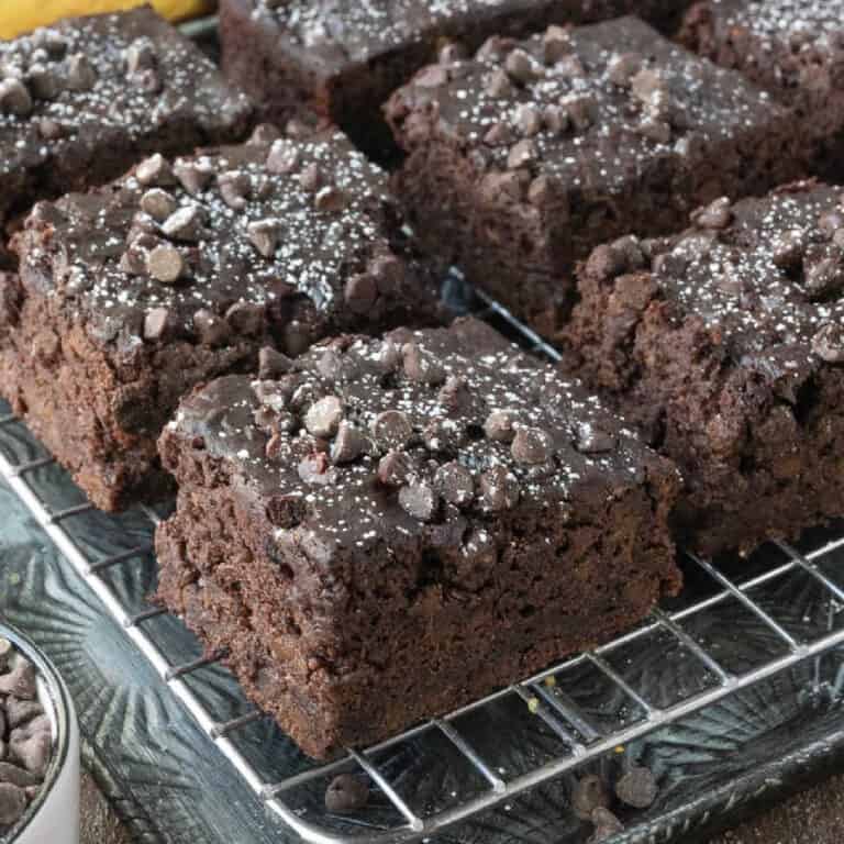 Pieces of chocolate banana cake on a sheet pan.