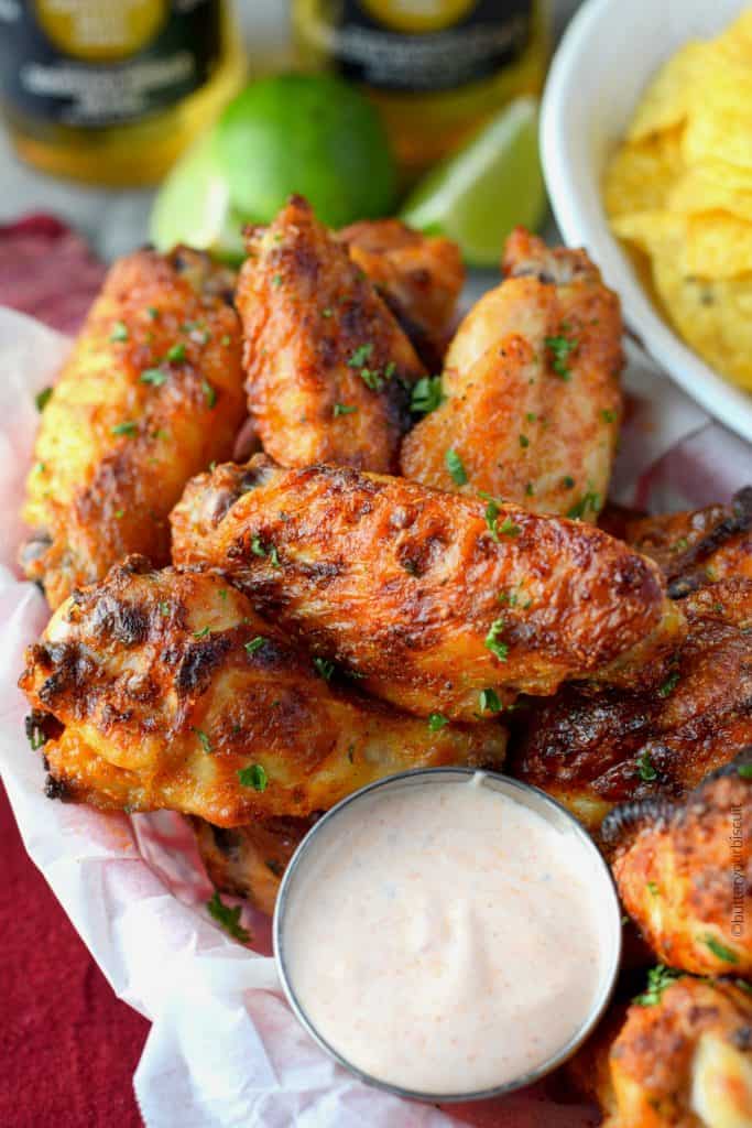 Spicy ranch chicken wings in a basket with dirty ranch sauce