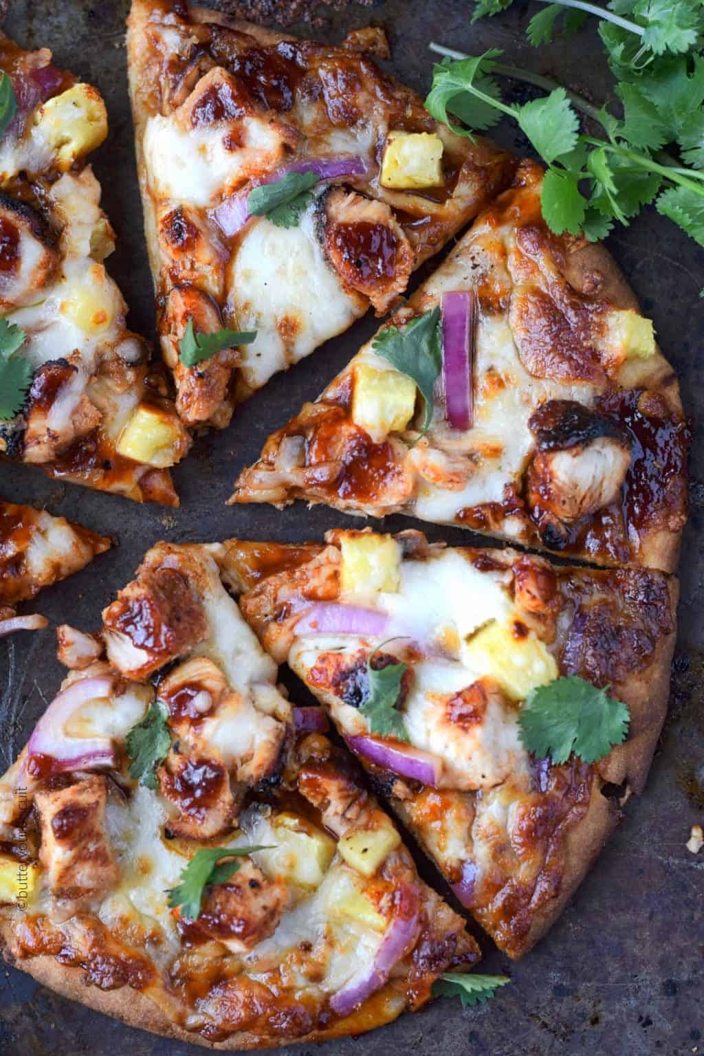 A close up photo of hawaiian bbq chicken flatbread.