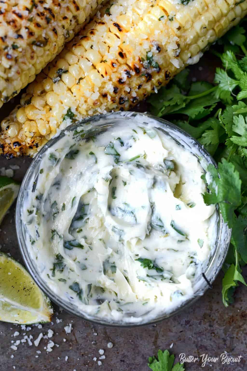 A small bowl with softened cilantro lime butter mixture.