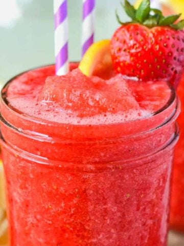 Strawberry vodka slush in a mason jar.
