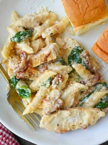 Tuscan chicken pasta on a plate.