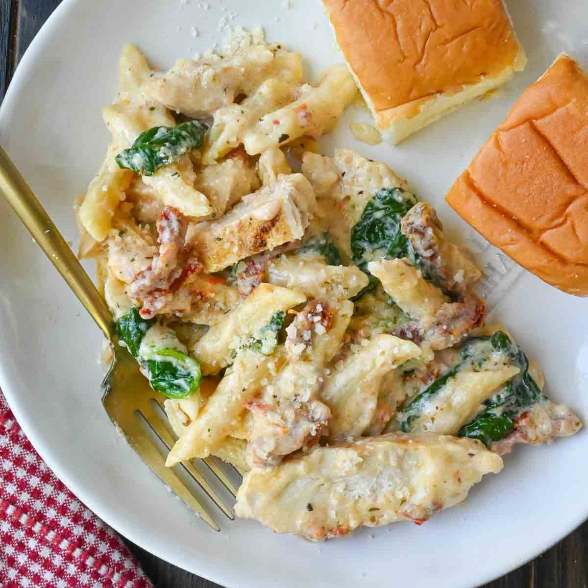 Tuscan chicken pasta on a plate.