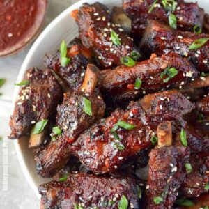 Chinese spare ribs piled on a white plate