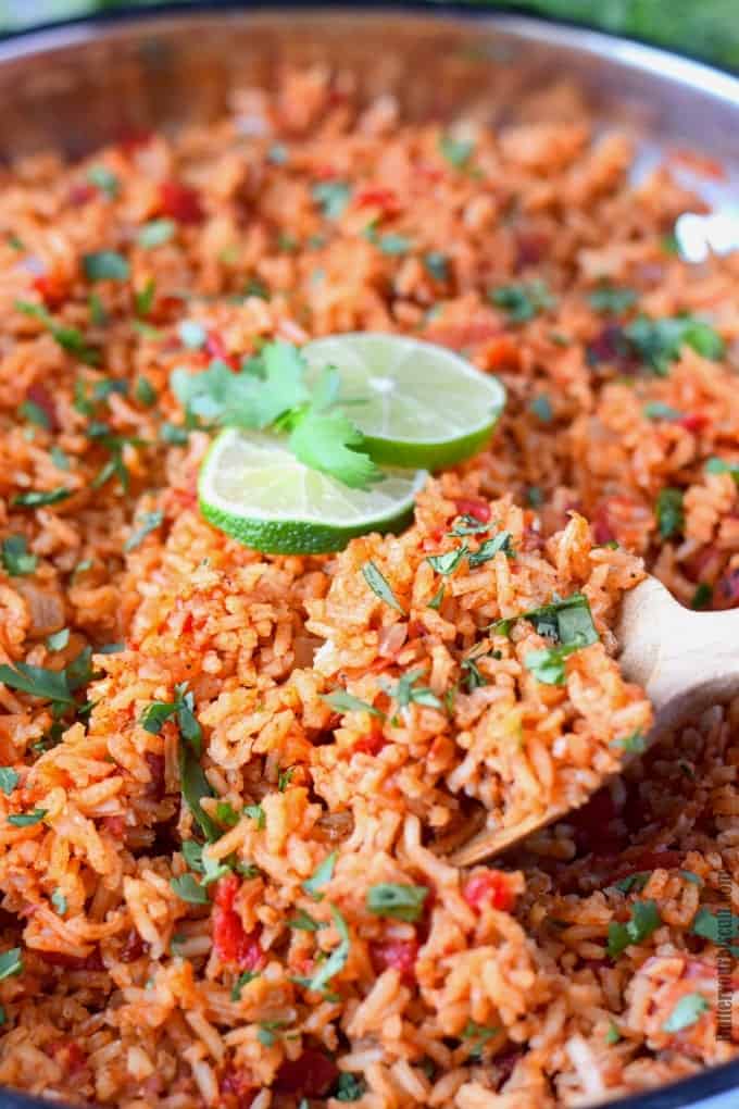A dish is filled with food, with Rice and Tomato