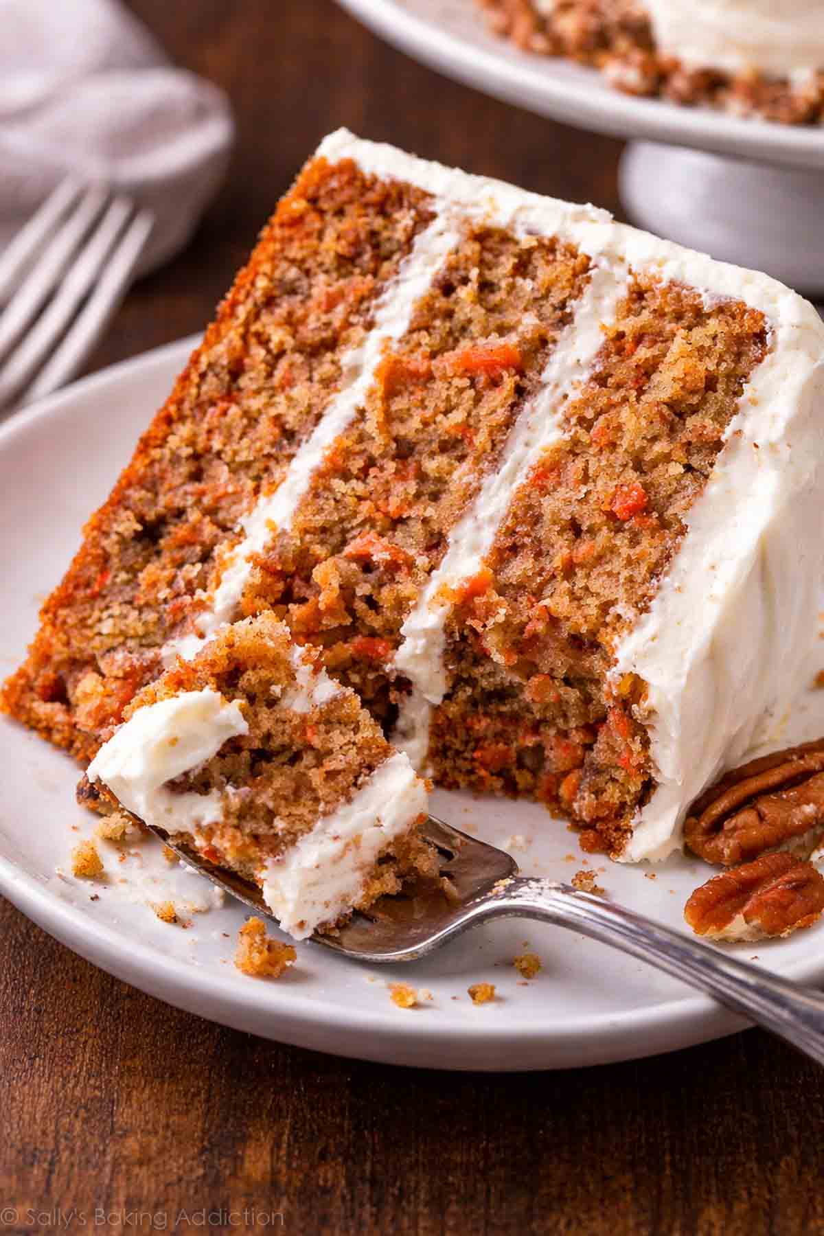 A slice of carrot cake on a plate.