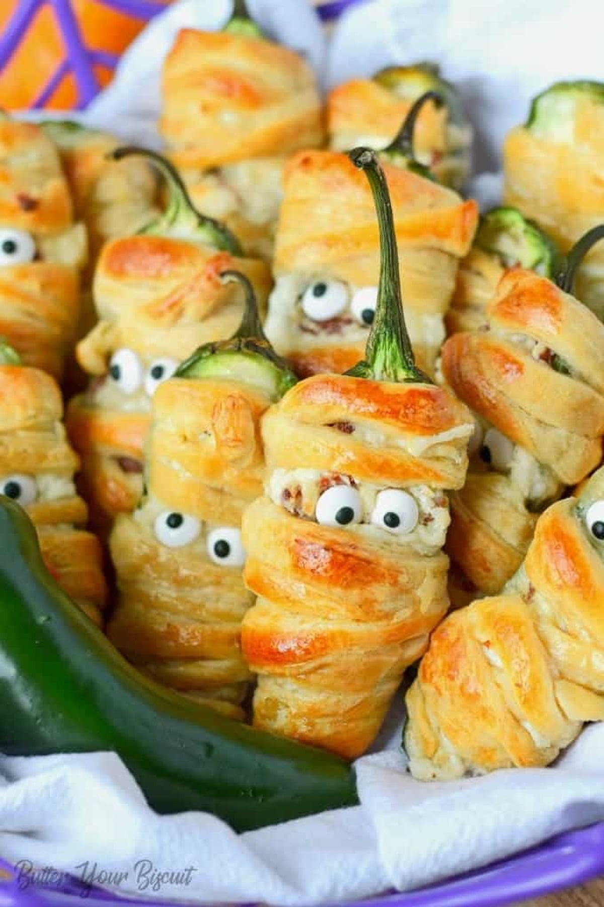 Bacon jalapeno wrapped mummies in a basket.