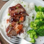 Chinese bbq pork on some white rive and broccoli.