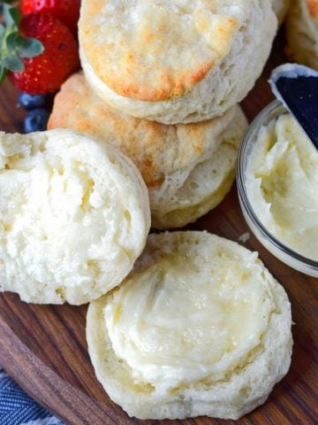 buttermilk biscuits with on sliced and honey butter