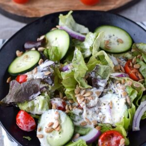 leafy green salad with creamy vinaigrette homemade salad dressing on top