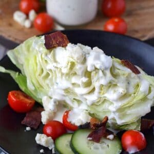 wedge salad with blue cheese homemade salad dressing poured on top