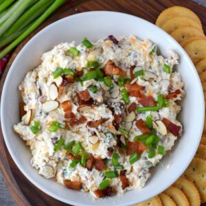party dips bacon ranch in a white bowl with crackers