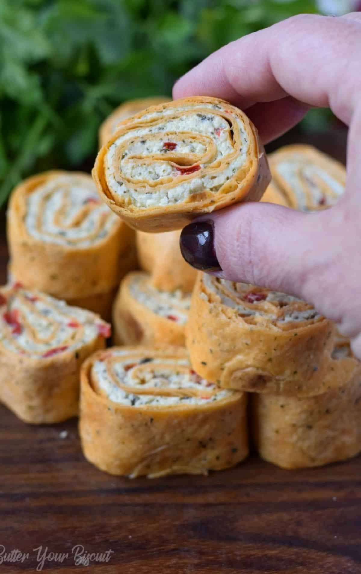 Rolled tortilla appetizers on a plate.