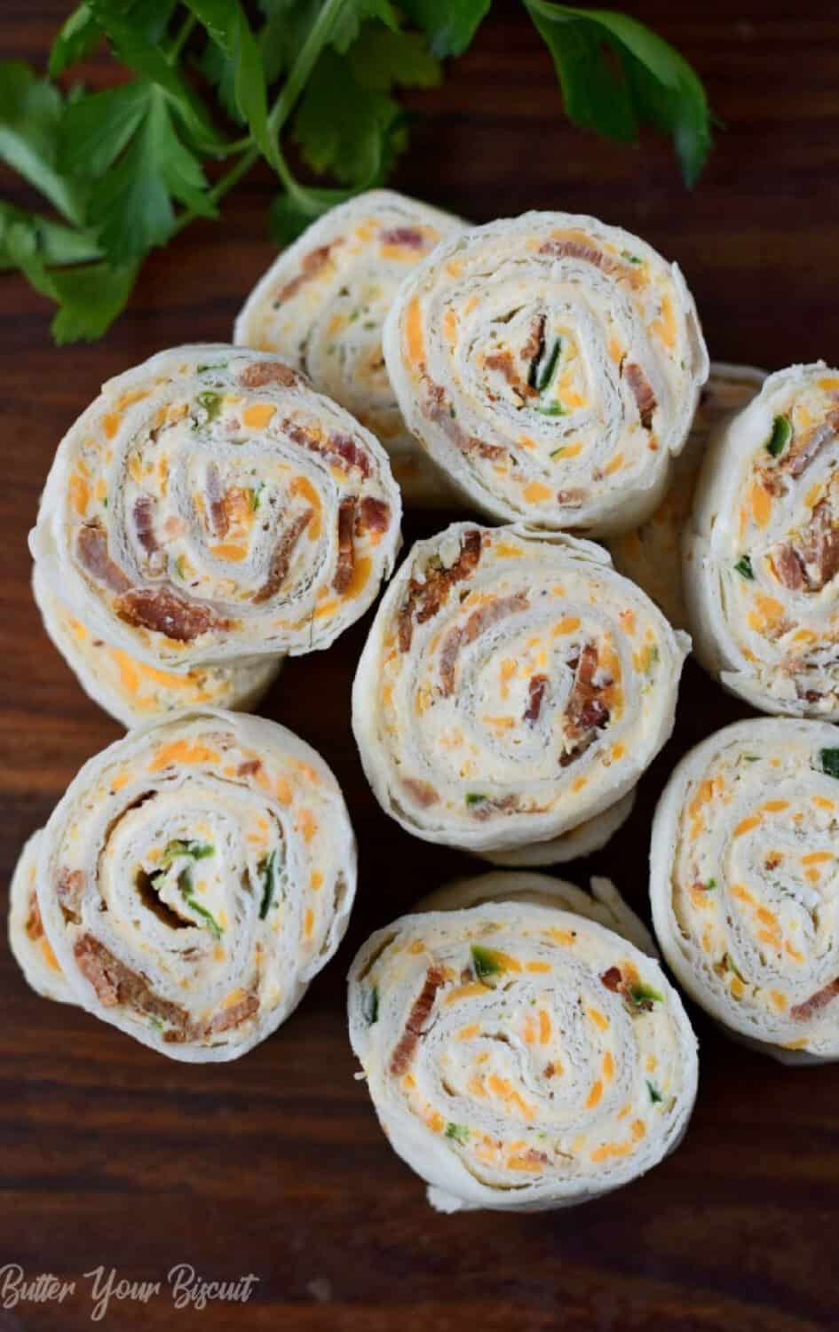 Rolled tortilla appetizers on a platter.