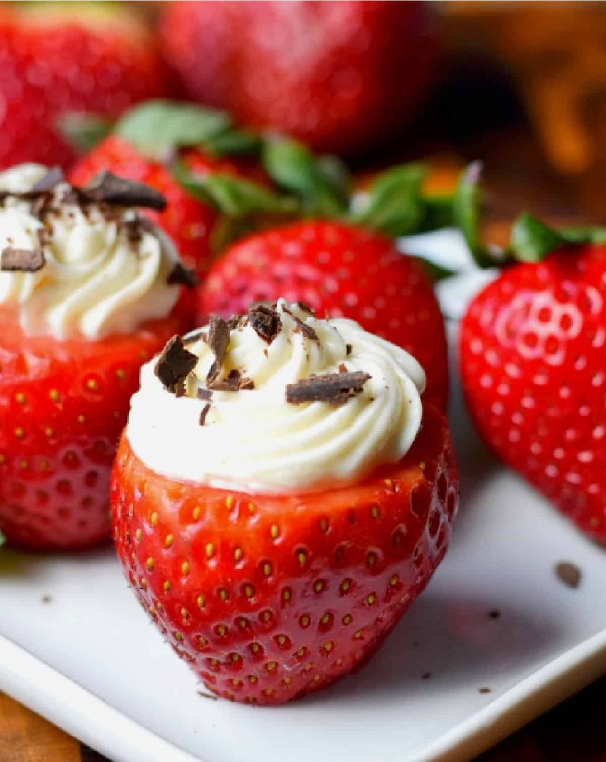 A close up photo of a cheesecake stuffed strawberry.