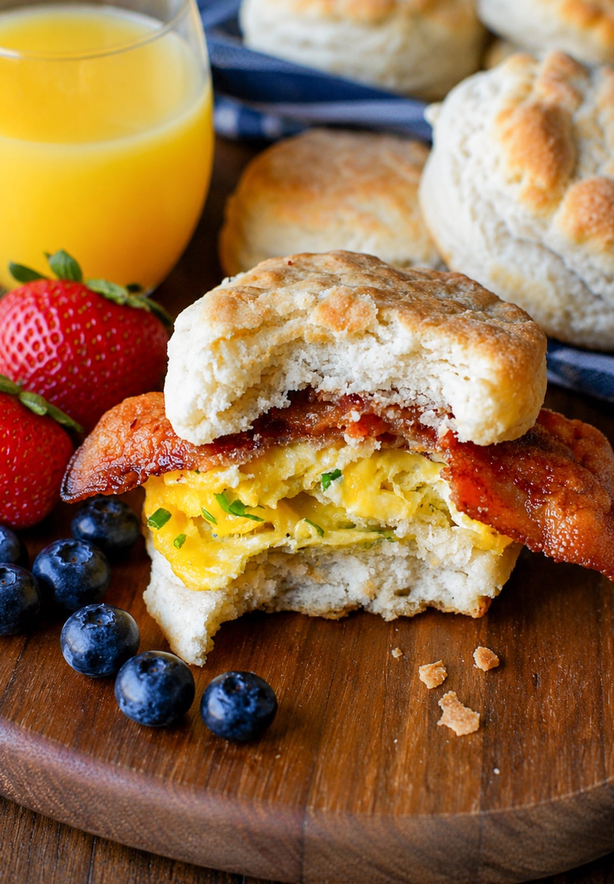 Bacon egg and cheese biscuit with a bite out of it.