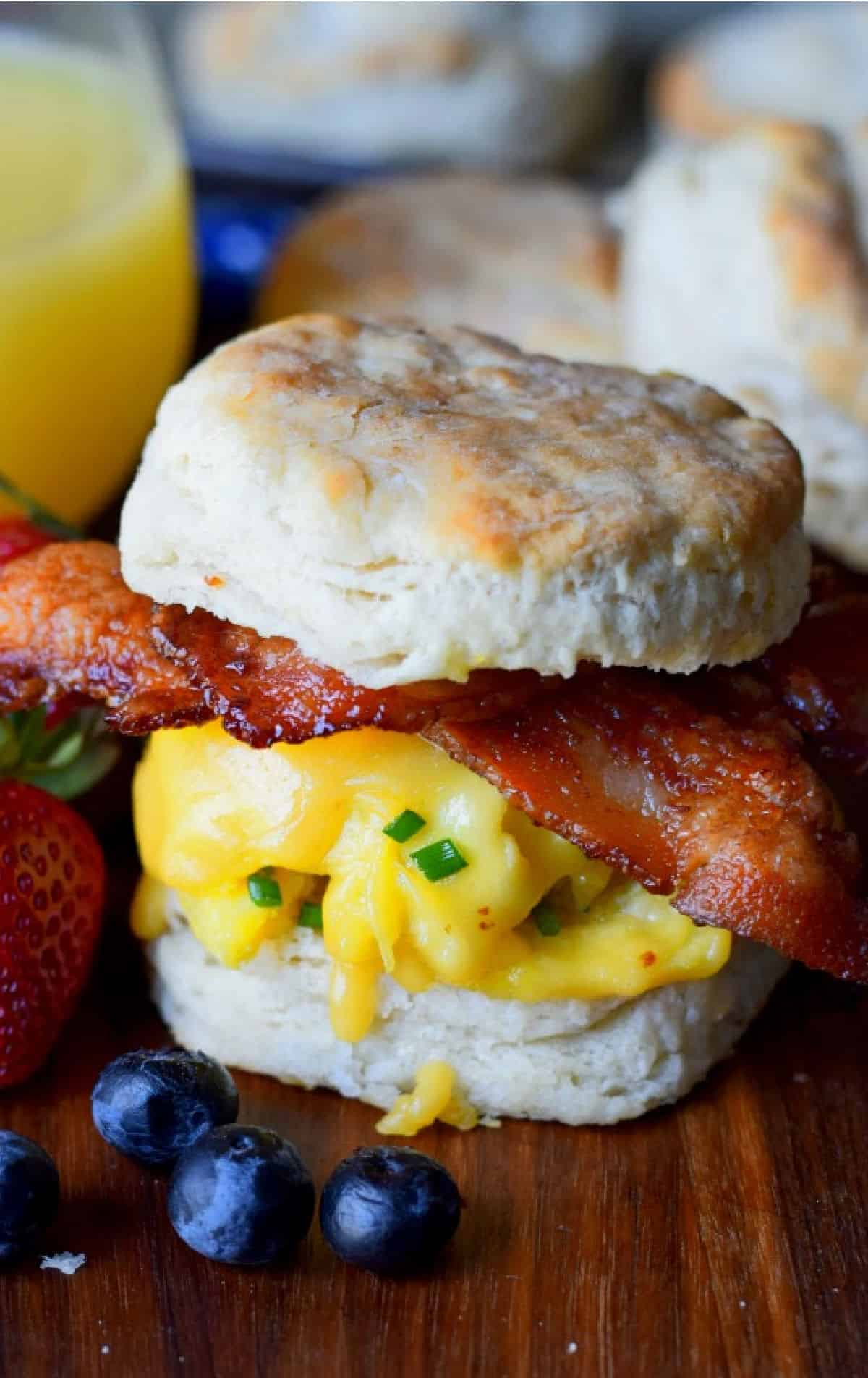 Bacon egg and cheese biscuit with a side of fruit