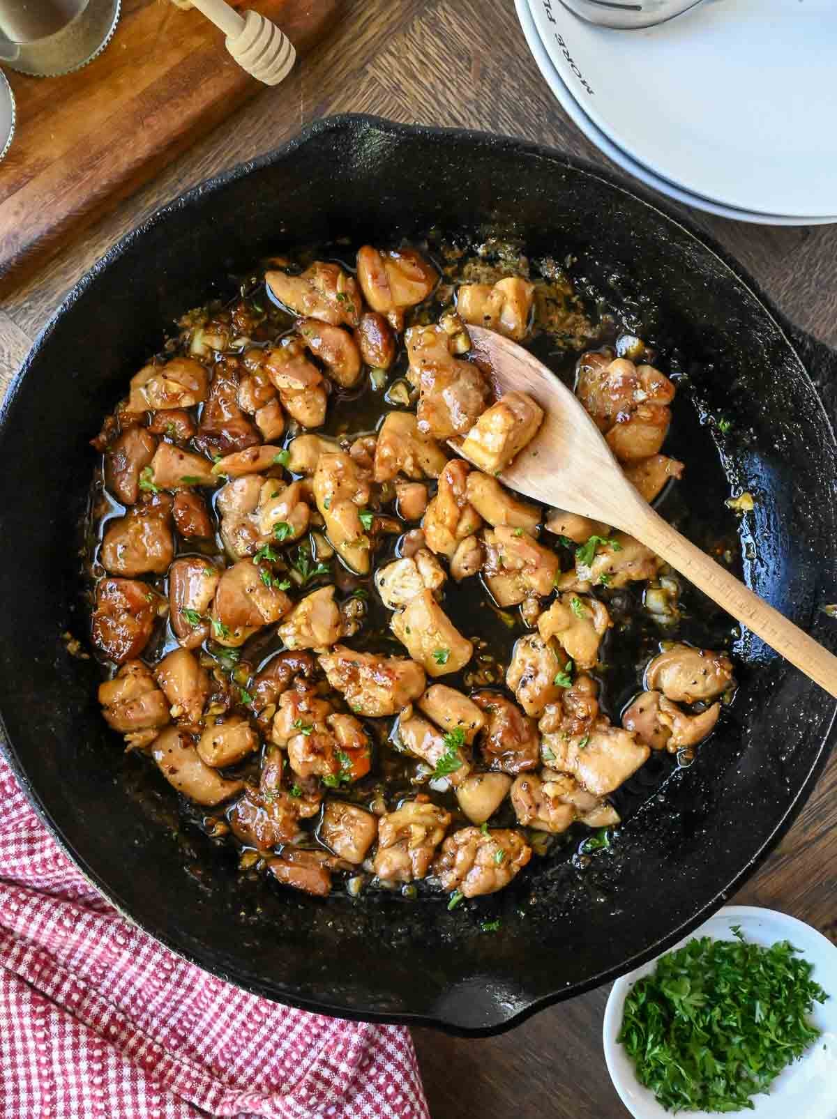 Garlic butter chicken cooked in a skillet.