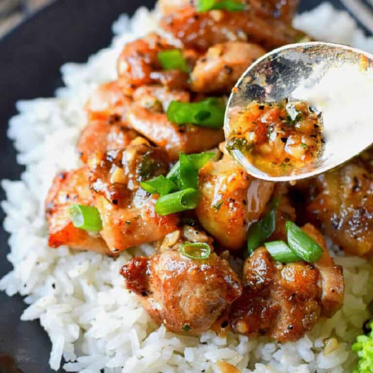Chicken bite on top of rice.