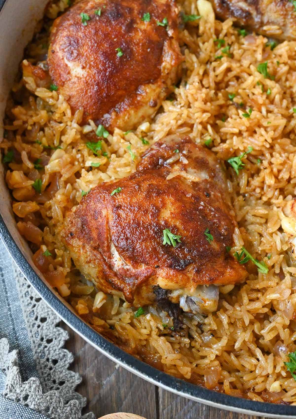Paprika chicken and rice in a skillet.