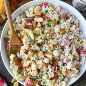 Bacon ranch pasta salad in a white serving bowl.