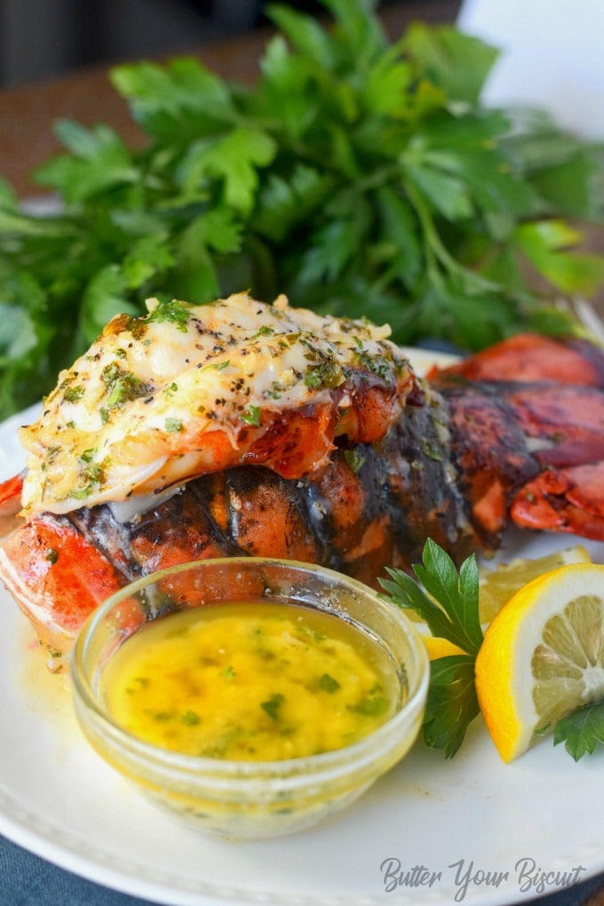 A lobster tail with butter poured on top.