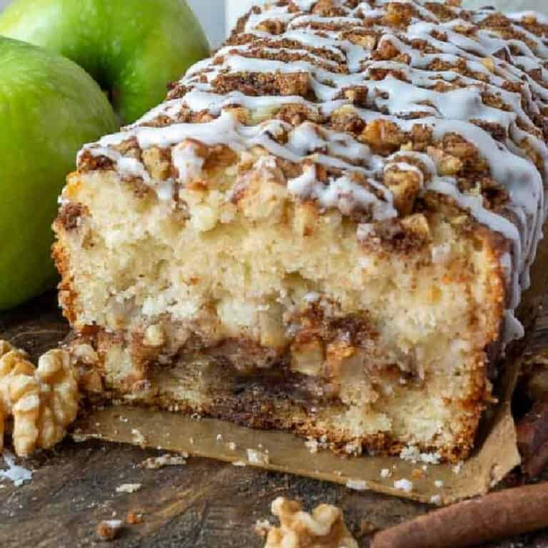 Apple cinnamon loaf with a slice cut away.