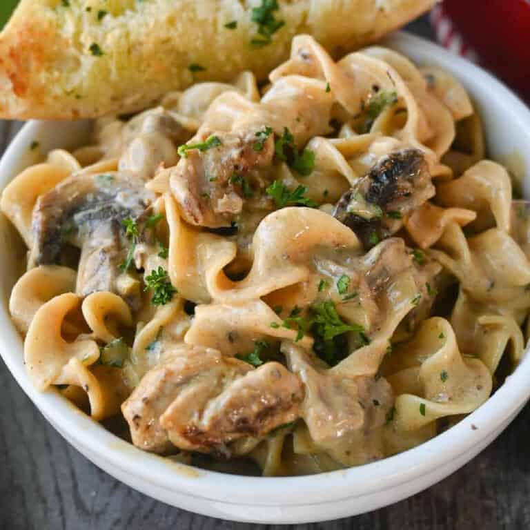 Chicken stroganoff in a small white bowl.