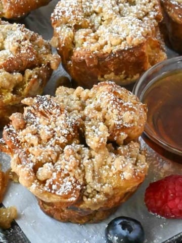 French toast muffins with a side of syrup.